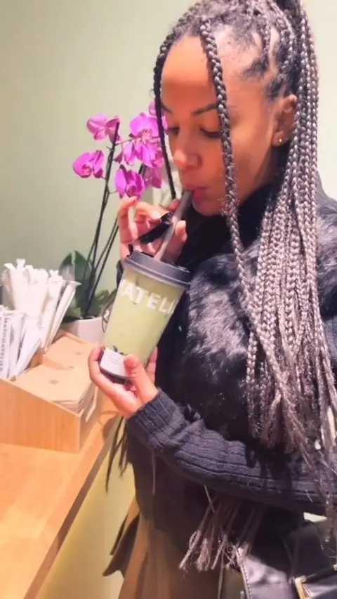 A creator filming a drink